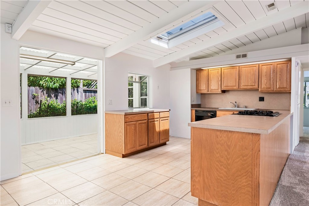 3357 Roxanne Avenue Long Beach, CA 90808 - Photo 12 of 52 a kitchen that has a sink and a stove top oven