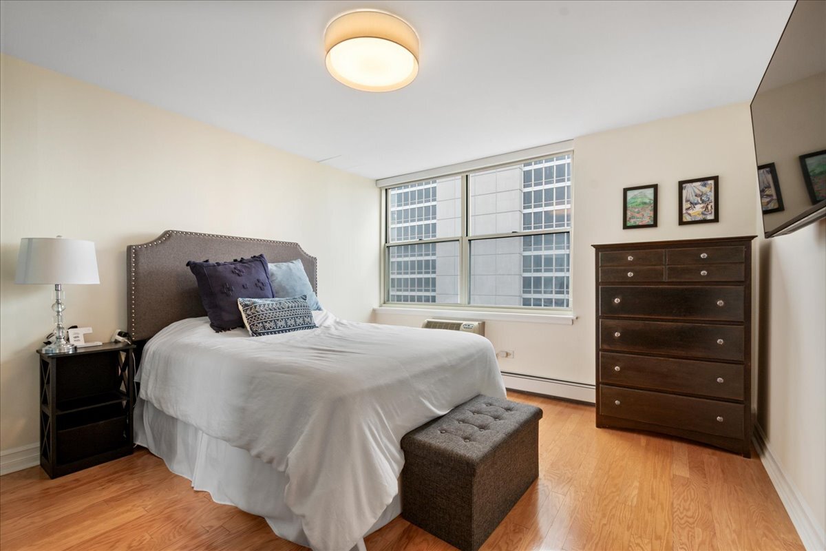 3033 North Sheridan Road, Unit 1605 Chicago, IL 60657 - Photo 14 of 21 a bedroom with a bed and a closet