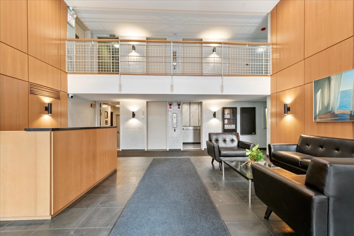 3033 North Sheridan Road, Unit 1605 Chicago, IL 60657 - Photo 2 of 21 a lobby with furniture and window