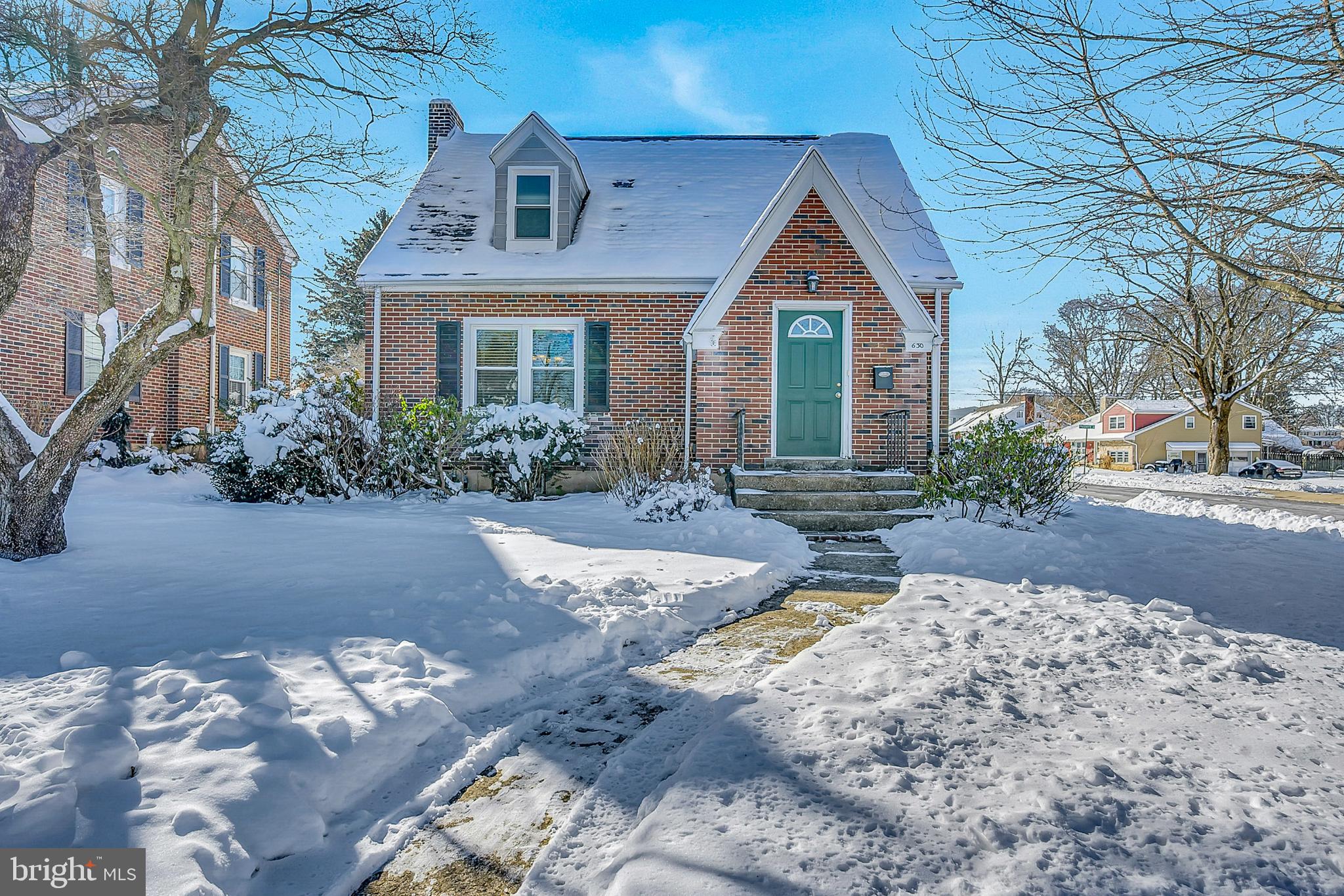 630 North 2nd Street Emmaus, PA 18049 - Photo 11 of 58 Charming brick home blanketed in snow.