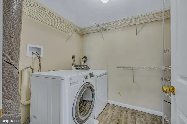 a bathroom with a granite countertop toilet and a sink