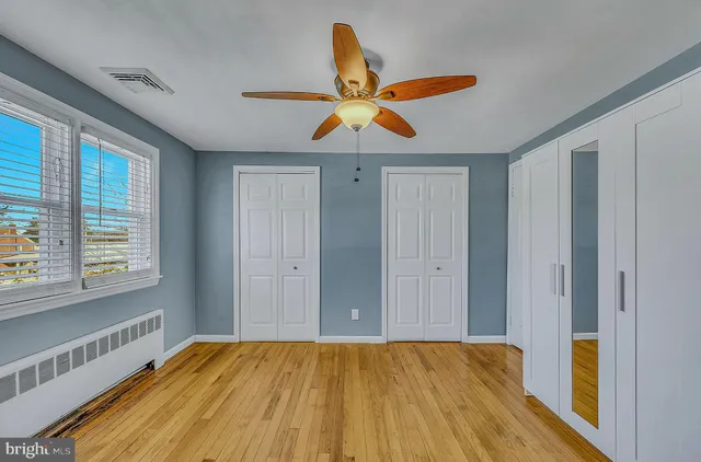 a bathroom with a sink a mirror and shower