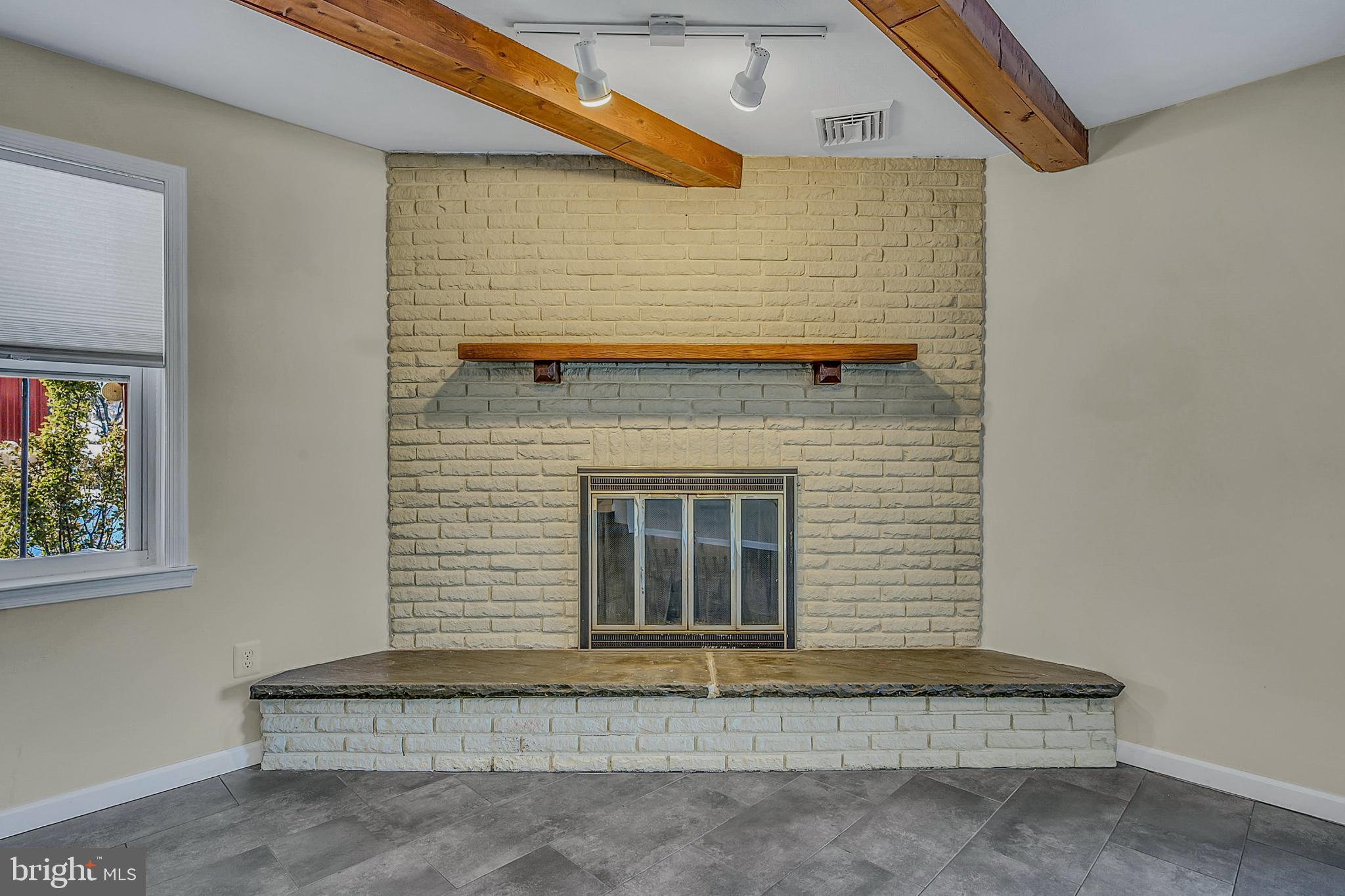 630 North 2nd Street Emmaus, PA 18049 - Photo 34 of 58 Cozy fireplace with rustic charm.