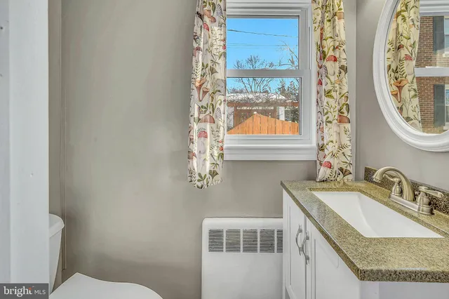 a view of wooden floor and windows in a room