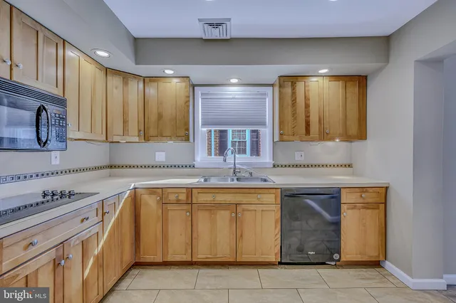 a picture of a room with a white wall and a large window