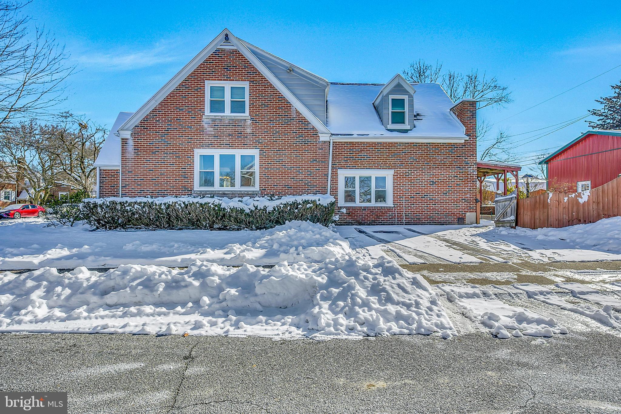 630 North 2nd Street Emmaus, PA 18049 - Photo 10 of 58 Charming brick home blanketed in snow.