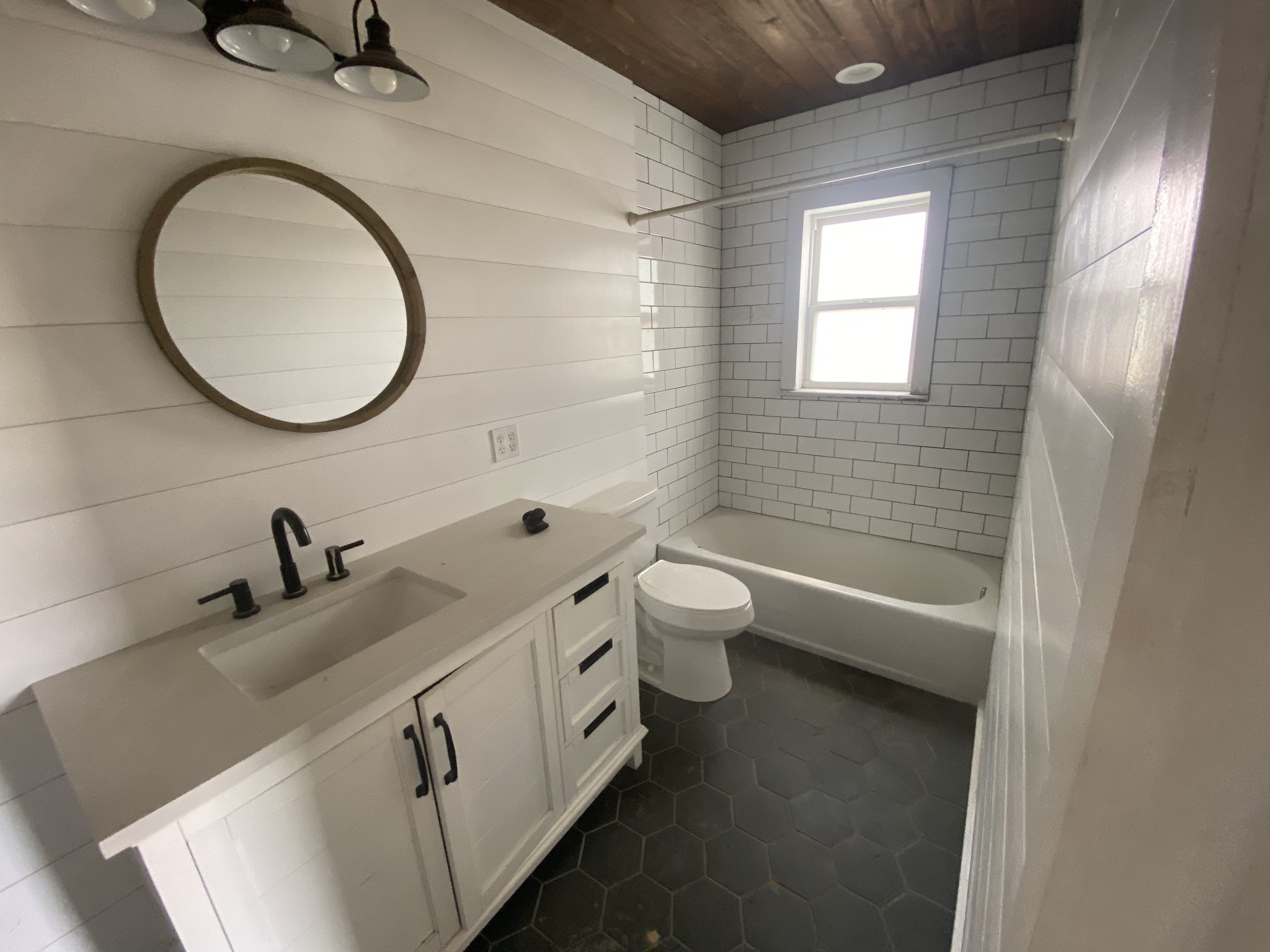301 Bob Perry Road Bethpage, TN 37022 - Photo 12 of 23 a bathroom with a granite countertop toilet a sink and a mirror