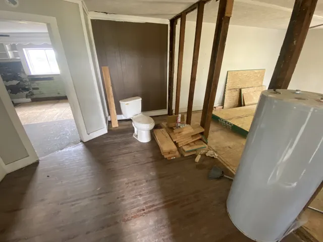 a view of living room with furniture and a mirror