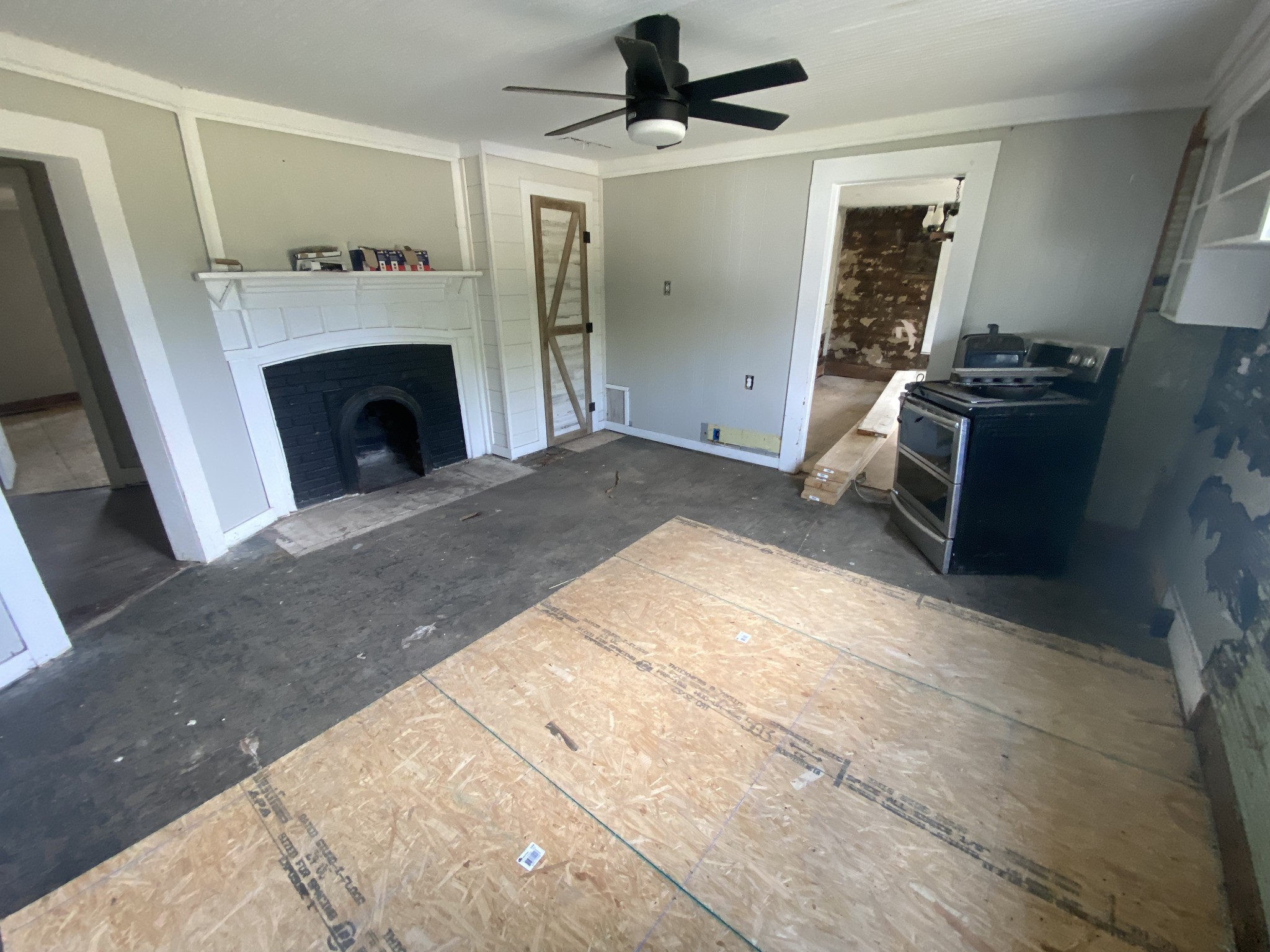 301 Bob Perry Road Bethpage, TN 37022 - Photo 4 of 23 a view of a kitchen with a sink a fireplace and a window