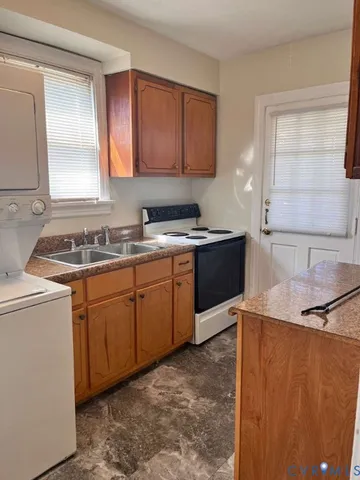 a kitchen with a sink stove and cabinets
