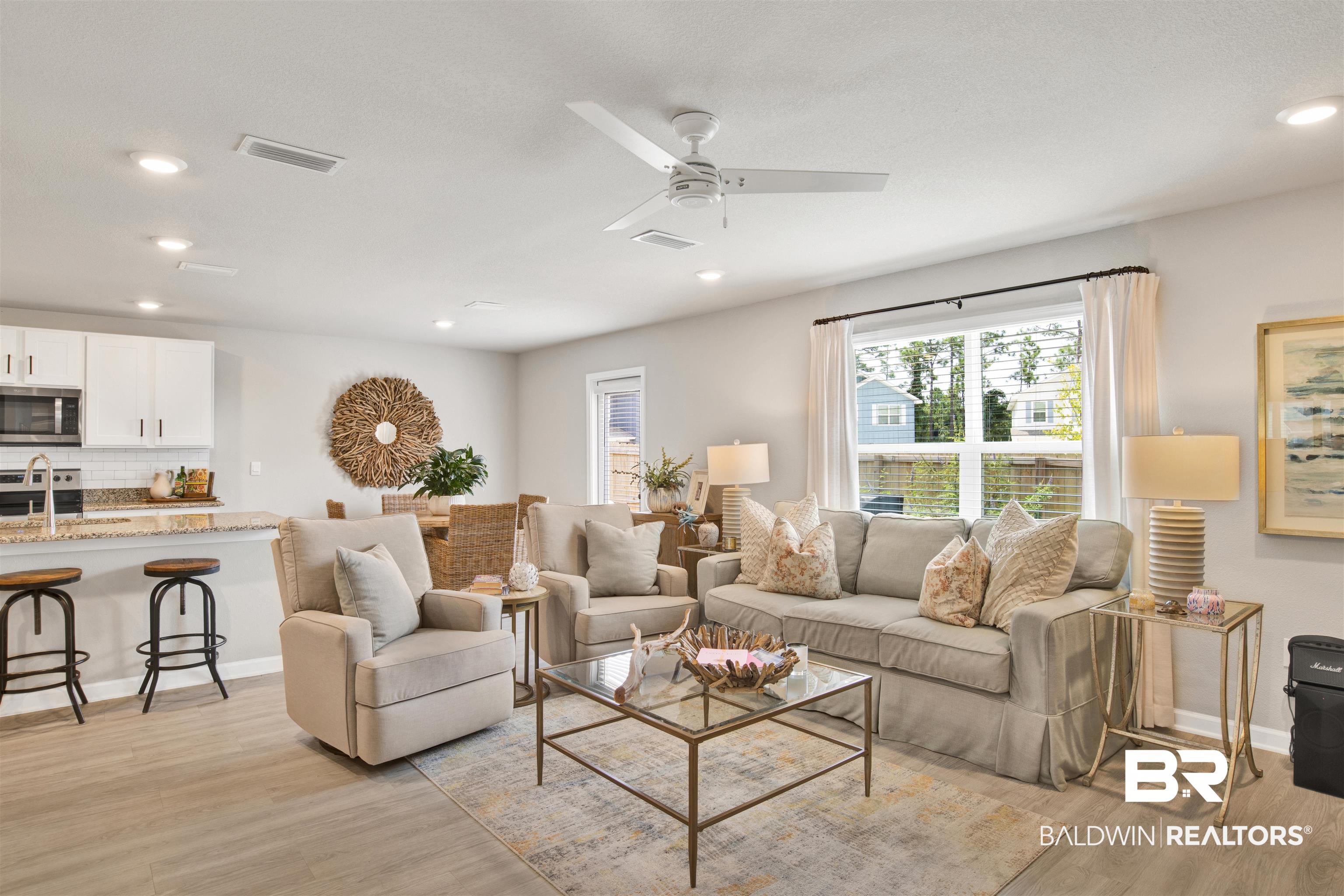 24532 Broken Sound Loop Orange Beach, AL 36561 - Photo 8 of 29 Living room with light wood-type flooring and ceiling fan