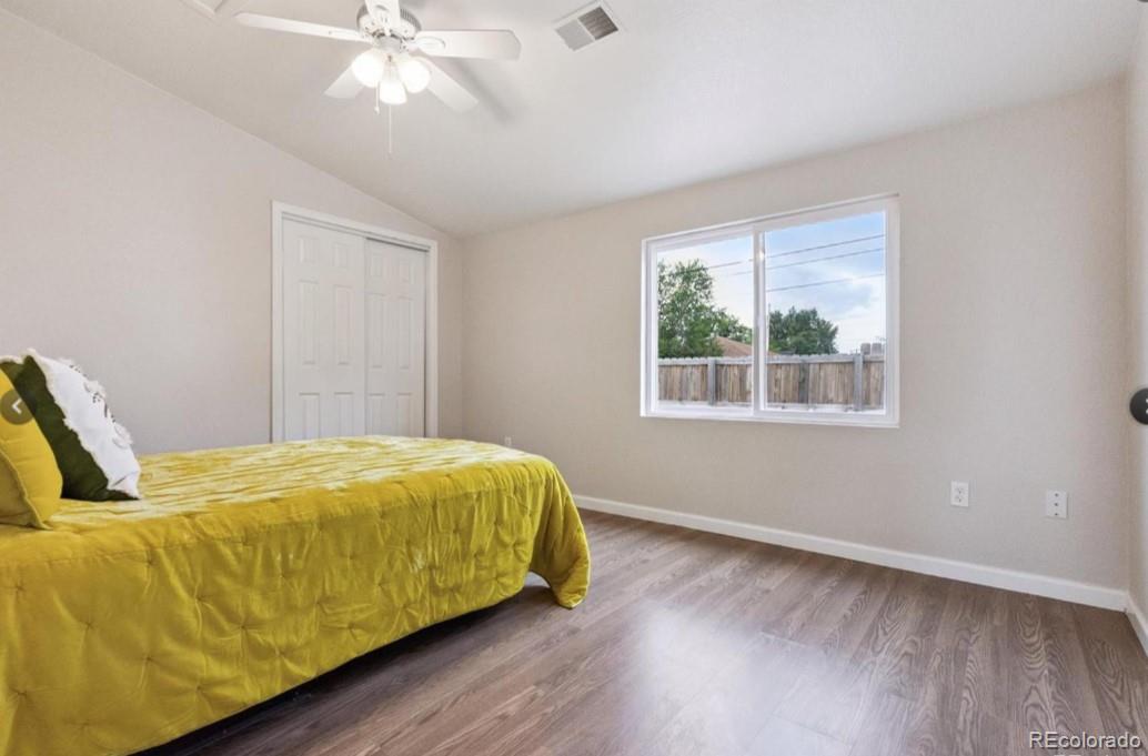 370 South Newton Street, Unit B Denver, CO 80219 - Photo 12 of 23 a bed sitting in a bedroom next to a window