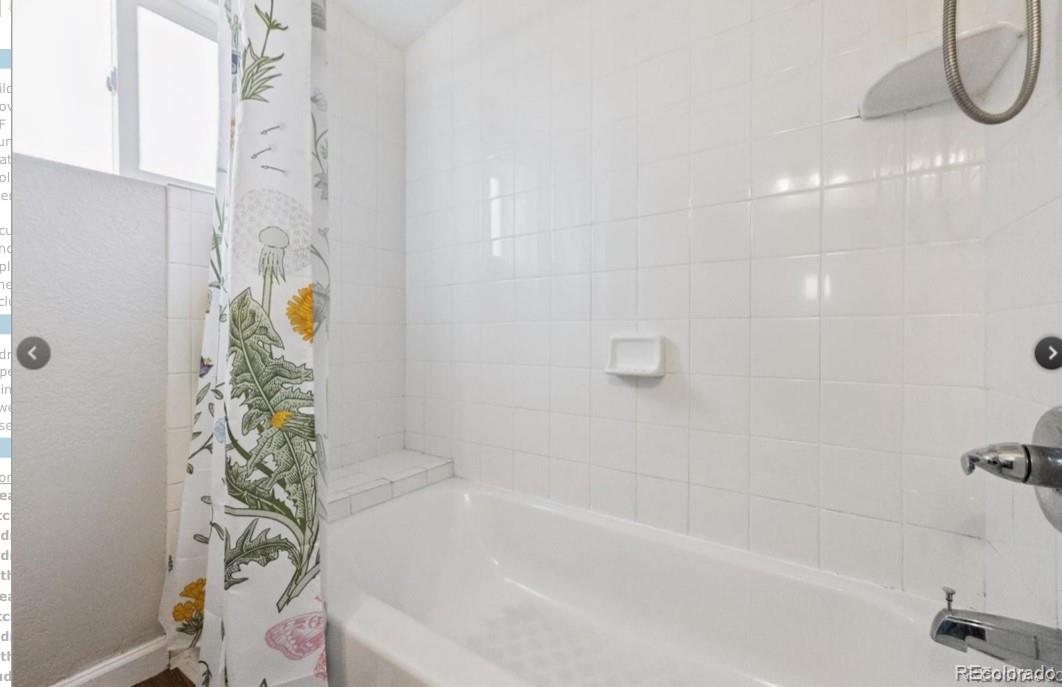 370 South Newton Street, Unit B Denver, CO 80219 - Photo 14 of 23 a bathroom with a bathtub and a shower