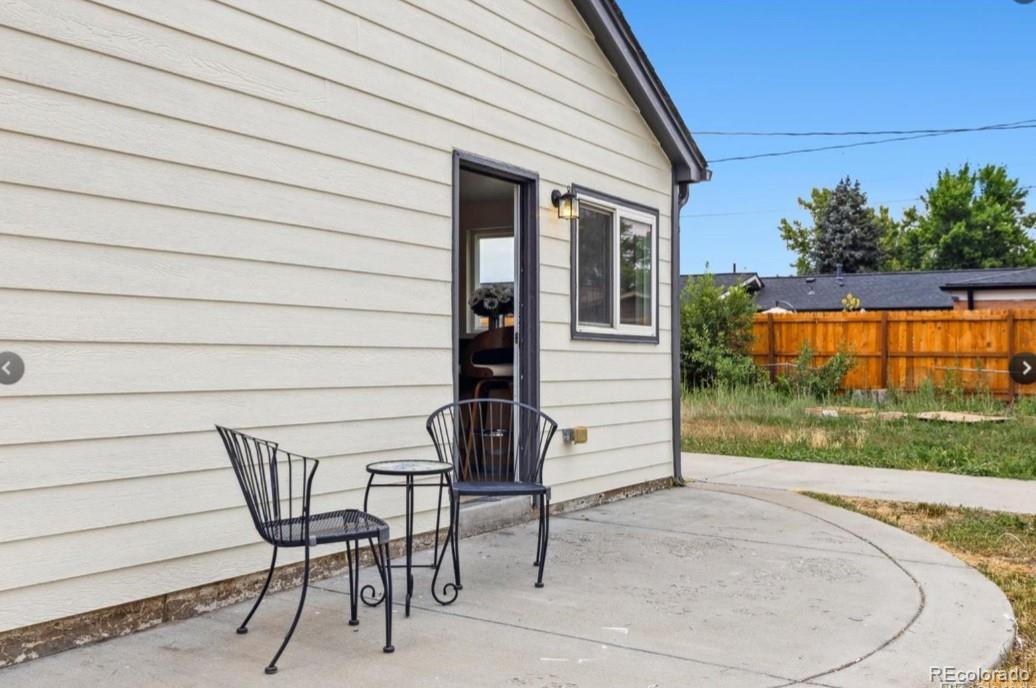 370 South Newton Street, Unit B Denver, CO 80219 - Photo 19 of 23 a view of backyard with seating space and wooden fence