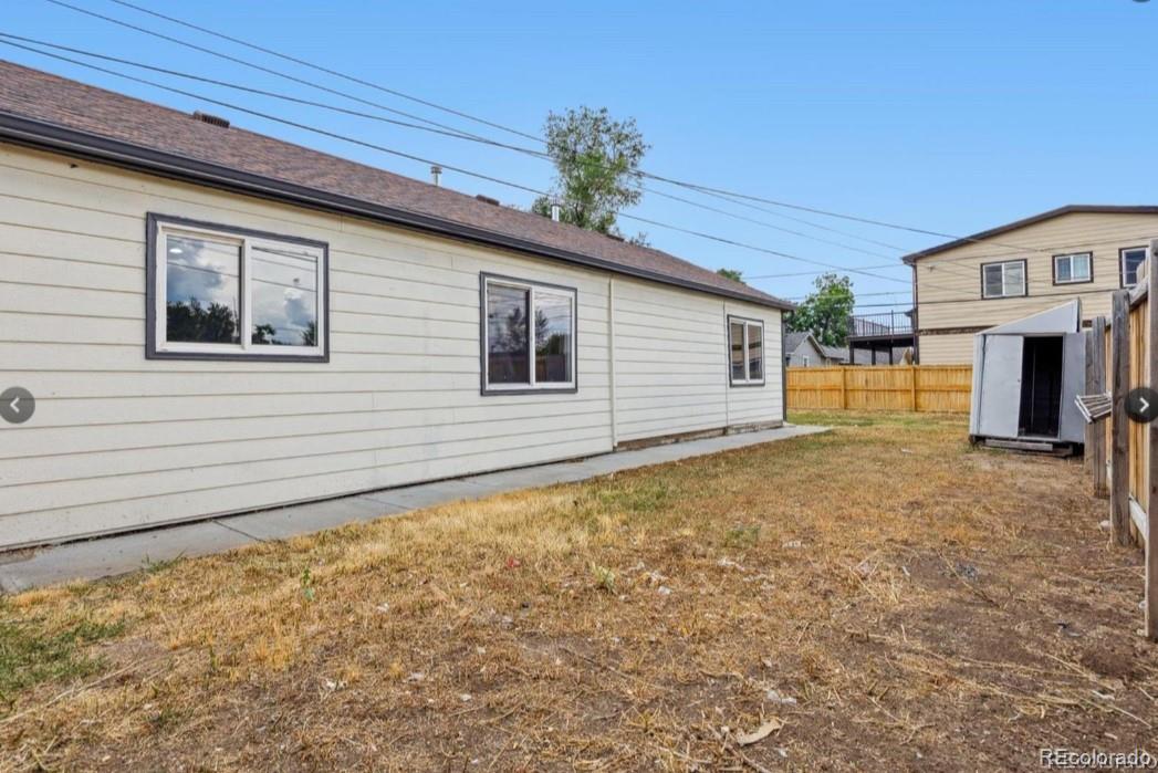 370 South Newton Street, Unit B Denver, CO 80219 - Photo 20 of 23 a view of a house with a backyard
