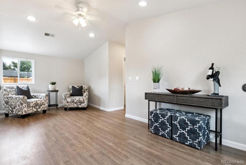 370 South Newton Street, Unit B Denver, CO 80219 - Photo 2 of 23 a living room with furniture and wooden floor