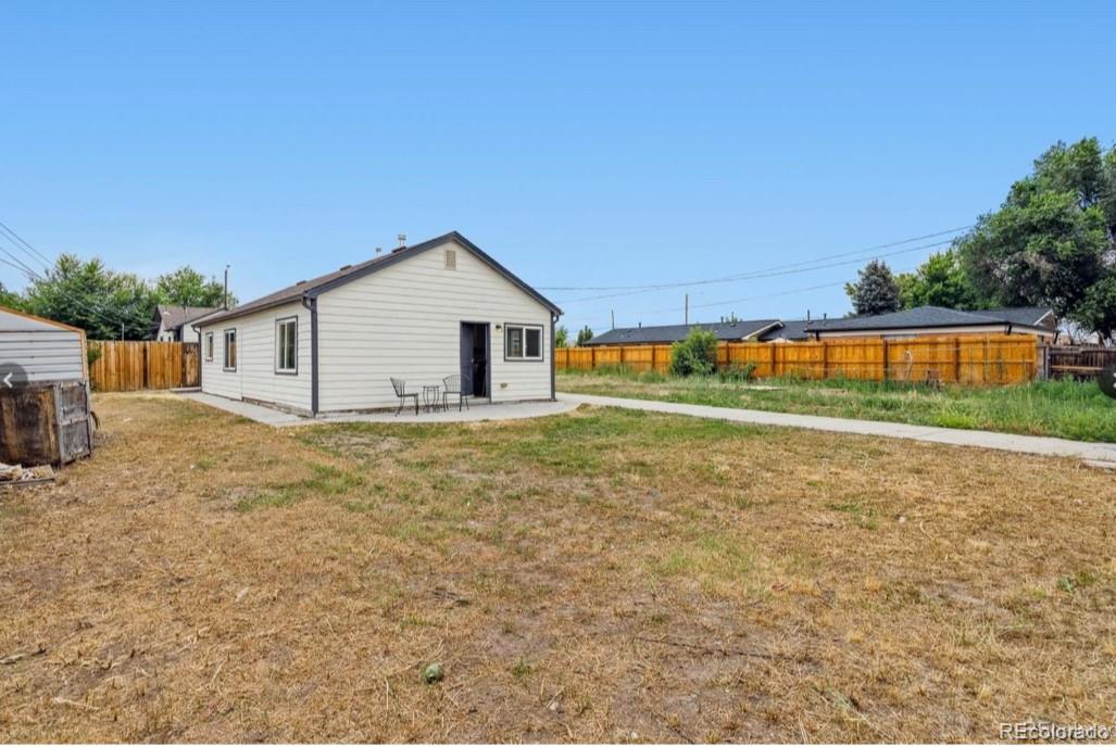 370 South Newton Street, Unit B Denver, CO 80219 - Photo 21 of 23 a view of a house with a yard