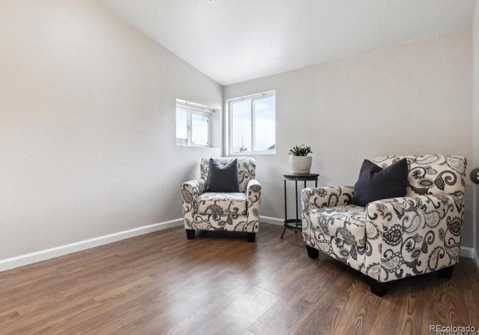 370 South Newton Street, Unit B Denver, CO 80219 - Photo 4 of 23 a living room with furniture and wooden floor