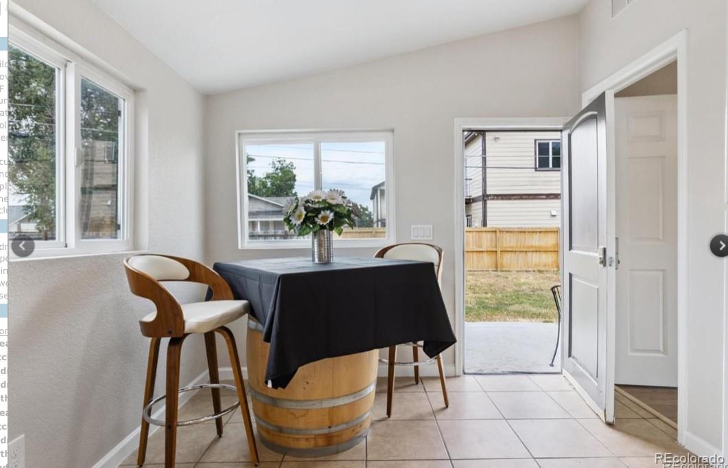 370 South Newton Street, Unit B Denver, CO 80219 - Photo 10 of 23 a living room with furniture and a window