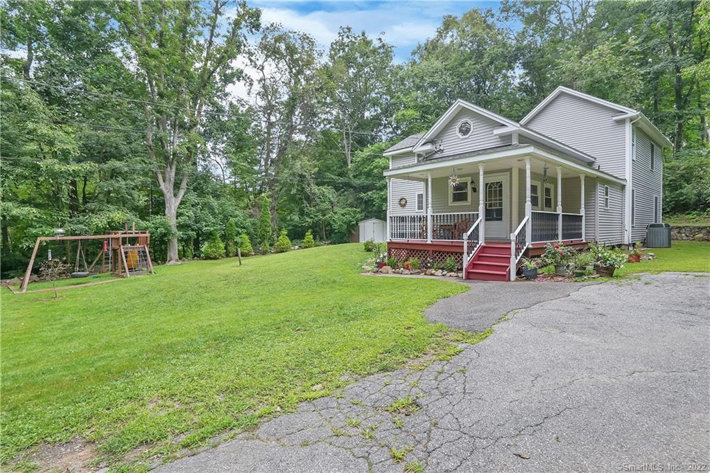 291 Spring Hill Road Monroe, CT 06468 - Photo 1 of 1 a front view of a house with garden