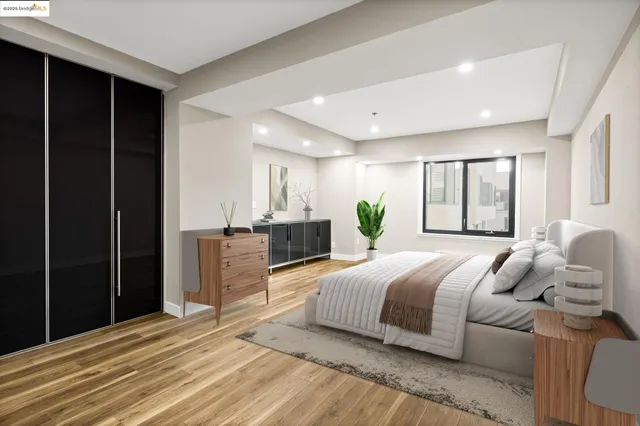 a bedroom with a large bed and a window