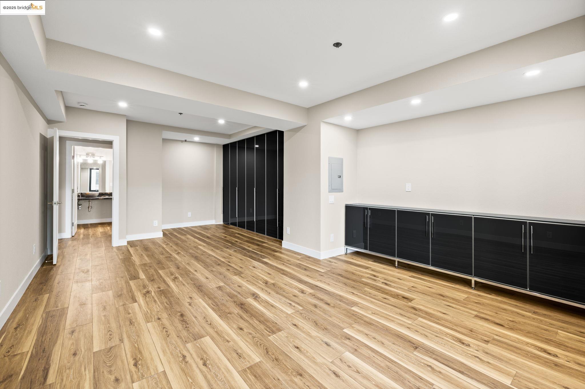 601 Van Ness Avenue, Unit 441 San Francisco, CA 94102 - Photo 20 of 58 a view of an empty room with wooden floor