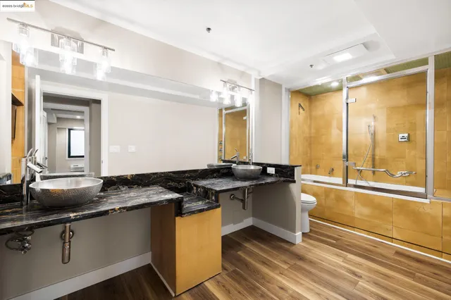 a kitchen with granite countertop a sink and a stove