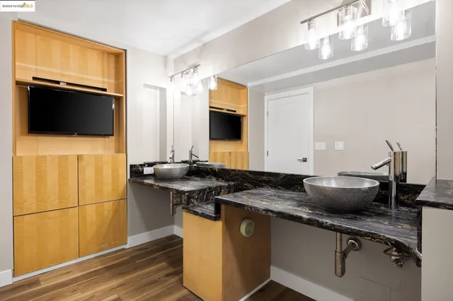 a kitchen with a sink and a refrigerator