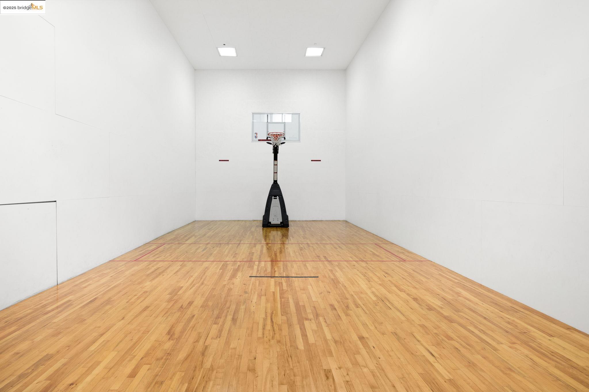601 Van Ness Avenue, Unit 441 San Francisco, CA 94102 - Photo 31 of 58 a view of a room with wooden floor and a ceiling fan