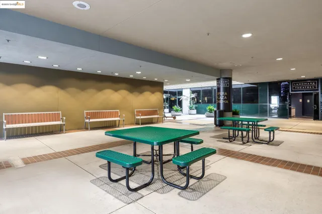 a view of a swimming pool with a fountain in front of house