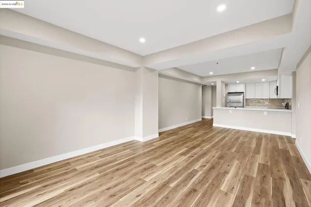 a view of a kitchen with wooden floor