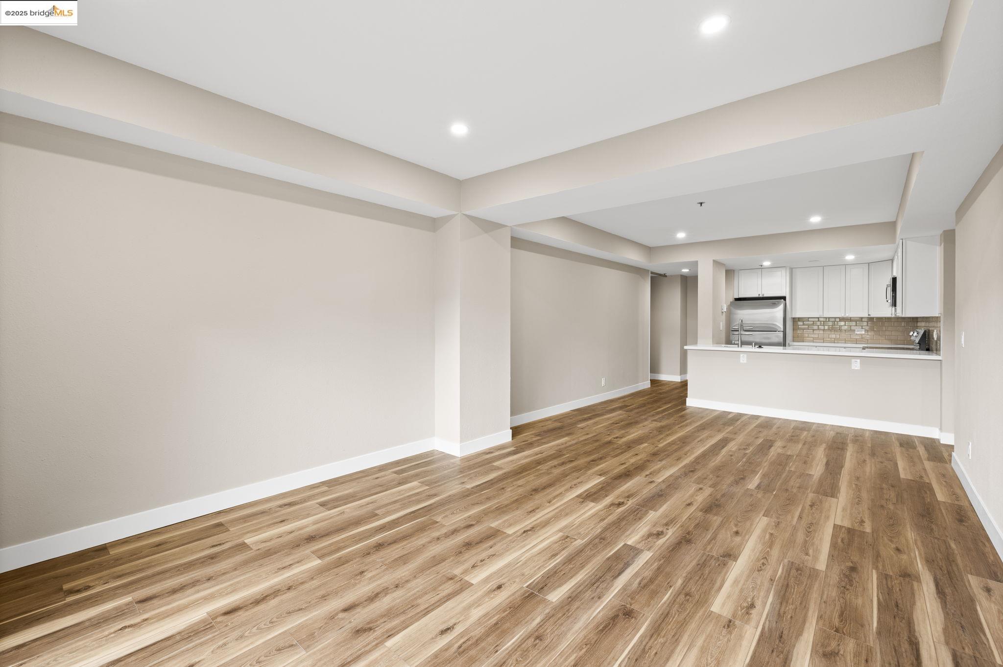 601 Van Ness Avenue, Unit 441 San Francisco, CA 94102 - Photo 8 of 58 a view of a kitchen with wooden floor