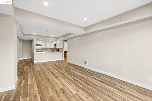 a view of kitchen and wooden floor