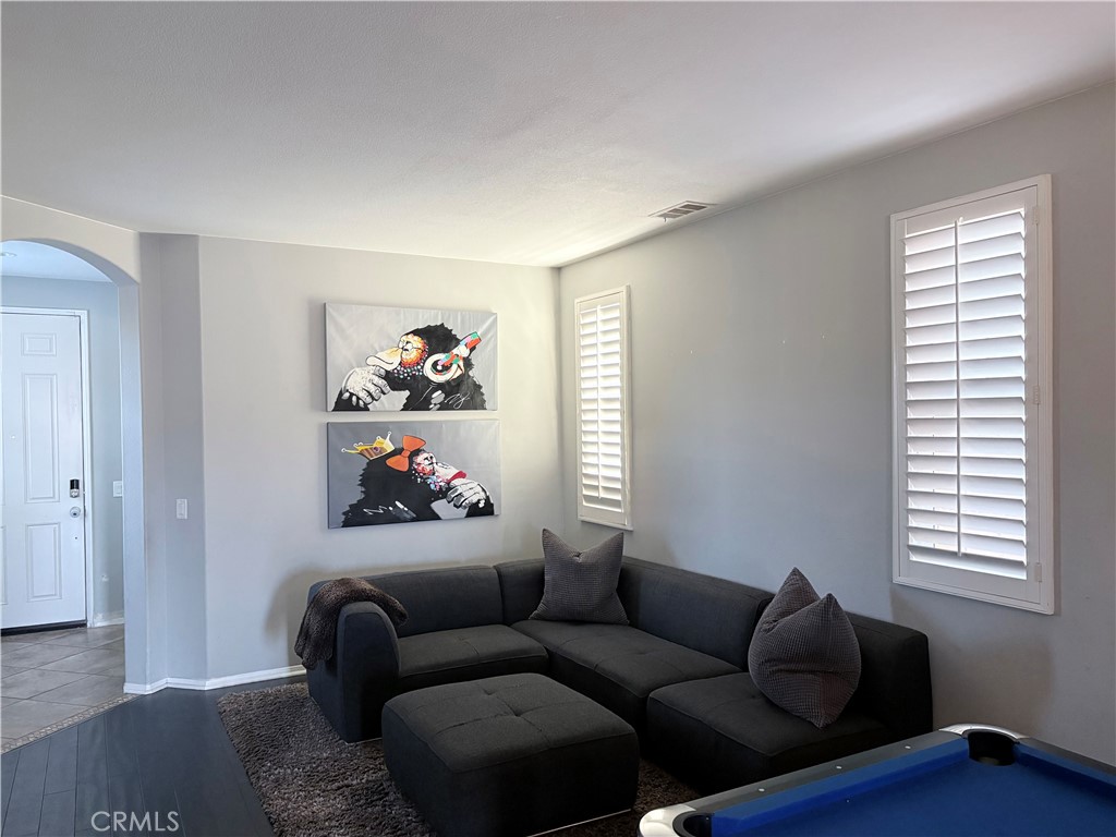2729 Hornbeam Road Palmdale, CA 93551 - Photo 27 of 35 a living room with furniture and a window