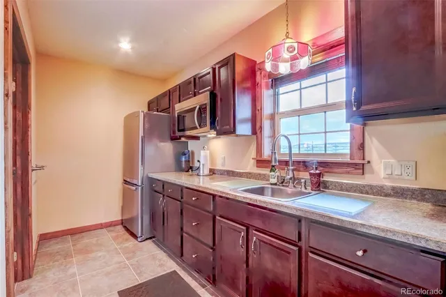 a very nice looking living room with lots of wooden furniture