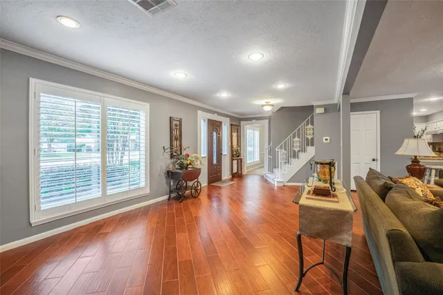 a view of a work space with furniture and wooden floor