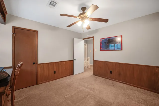 a view of workspace with window and ceiling fan