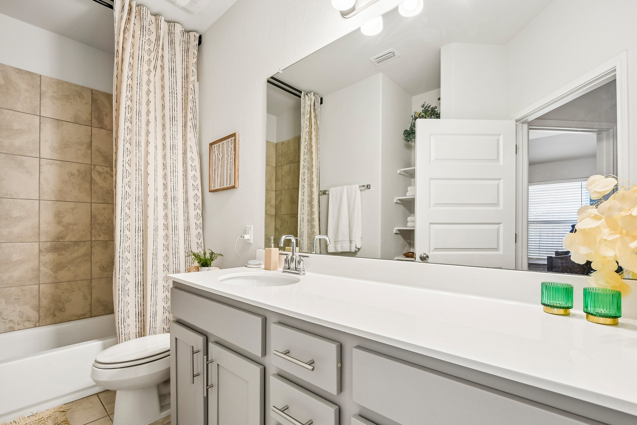 10700 Sentinel Drive Austin, TX 78747 - Photo 21 of 27 A third full bathroom services the other secondary bedrooms and is conveniently located for guests.