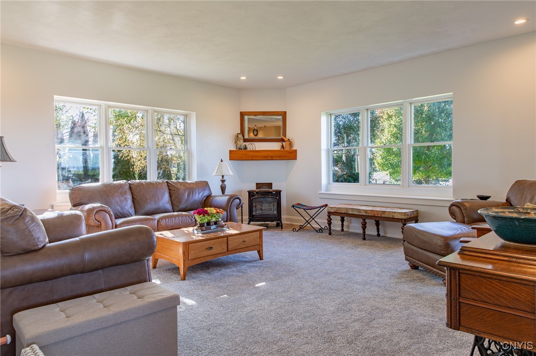 5857 East Lake Road Cazenovia, NY 13035 - Photo 6 of 48 Cozy living room with a vermont casting gas stove