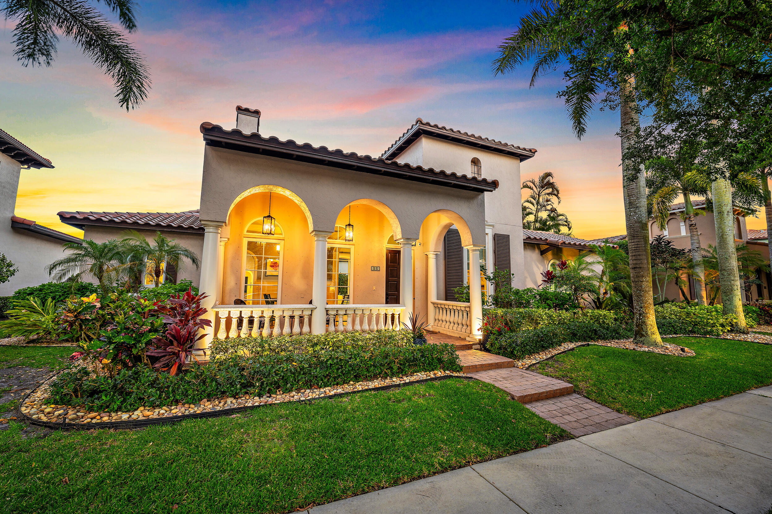 105 Segovia Way Jupiter, FL 33458 - Photo 33 of 33 a view of a grey house with a yard