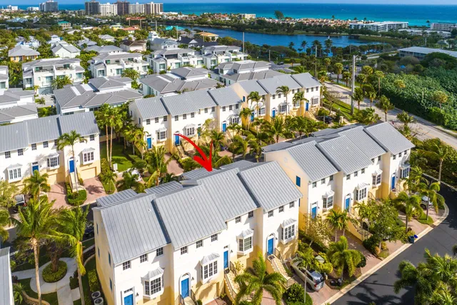 an aerial view of residential houses with outdoor space