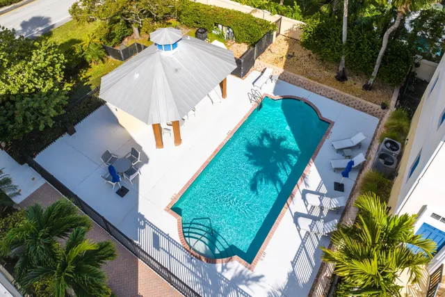 a view of a swimming pool with a yard