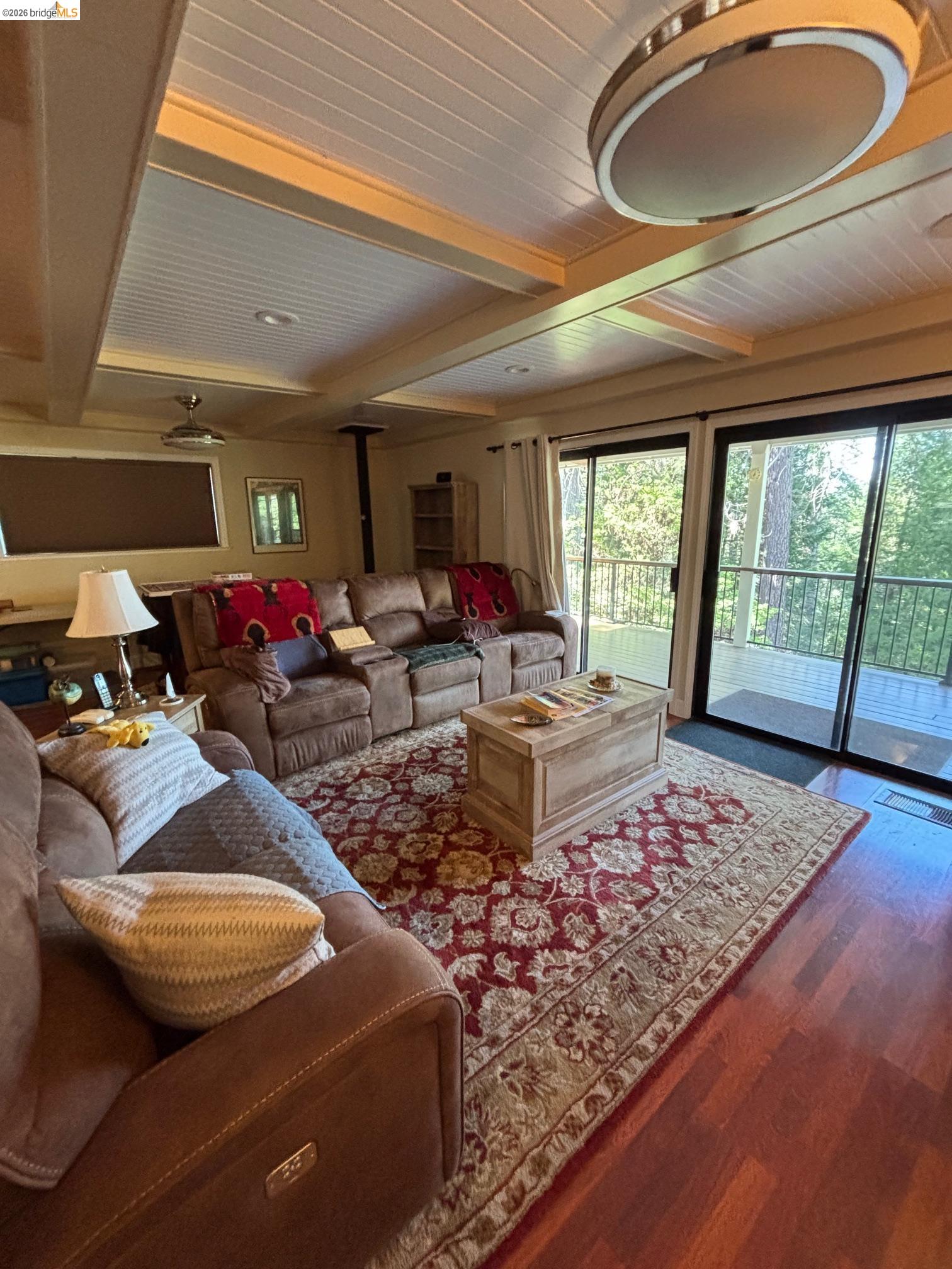 20728 Point View Drive Groveland, CA 95321 - Photo 13 of 45 a living room with furniture and a floor to ceiling window