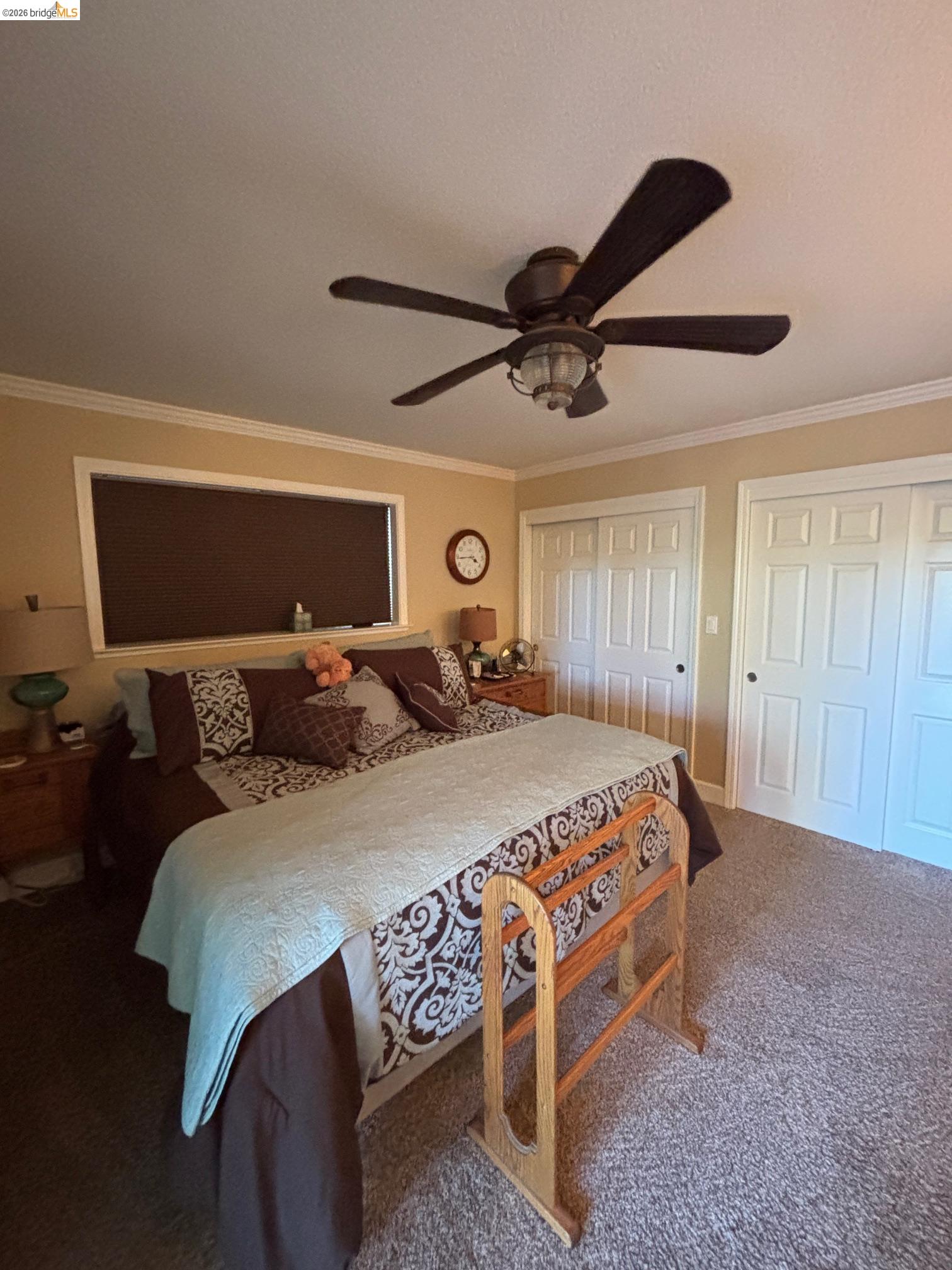 20728 Point View Drive Groveland, CA 95321 - Photo 19 of 45 a bedroom with a bed a ceiling fan and a dresser