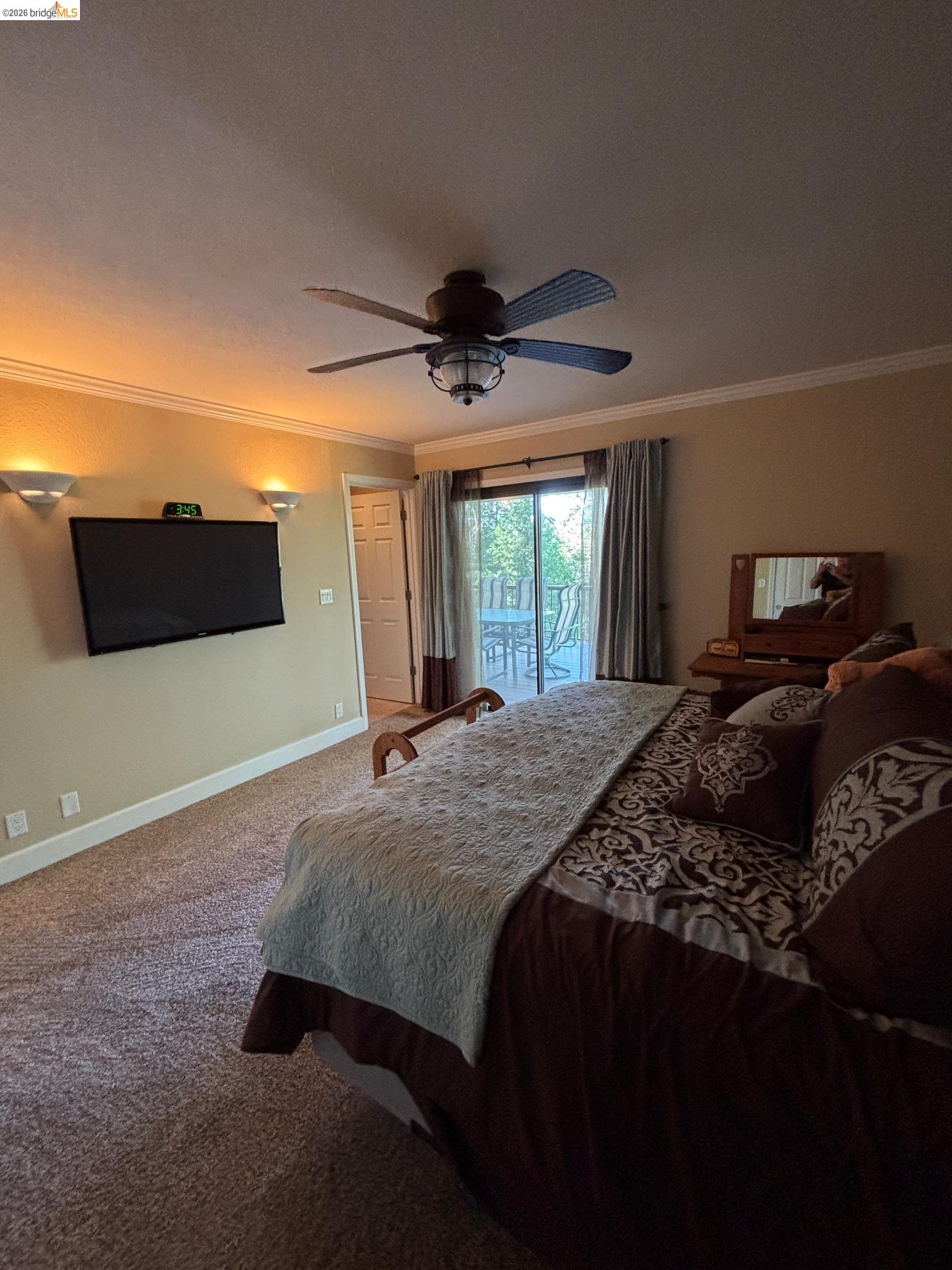 20728 Point View Drive Groveland, CA 95321 - Photo 20 of 45 a bedroom with a bed and a chandelier