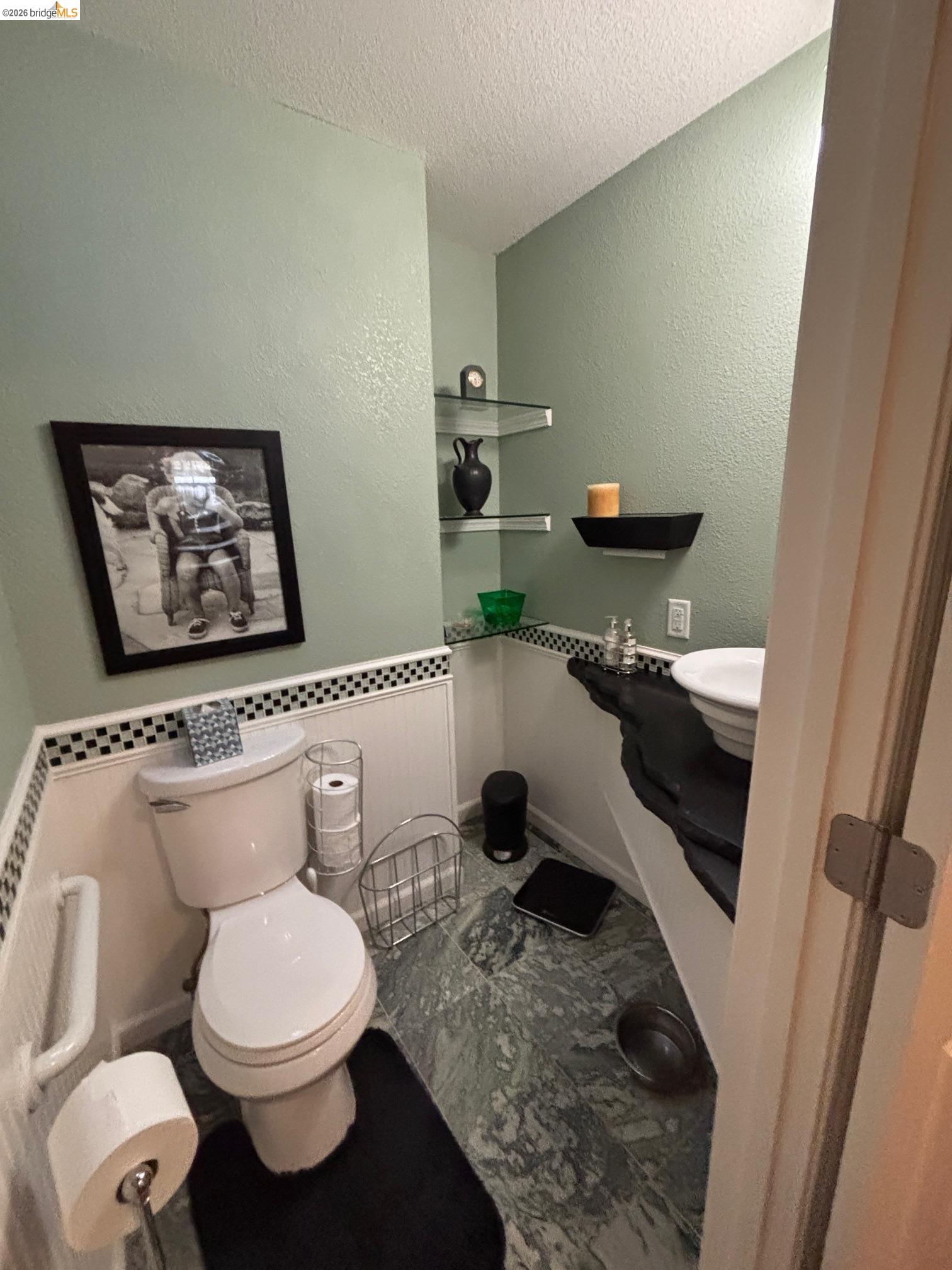 20728 Point View Drive Groveland, CA 95321 - Photo 29 of 45 a bathroom with a toilet a sink and mirror