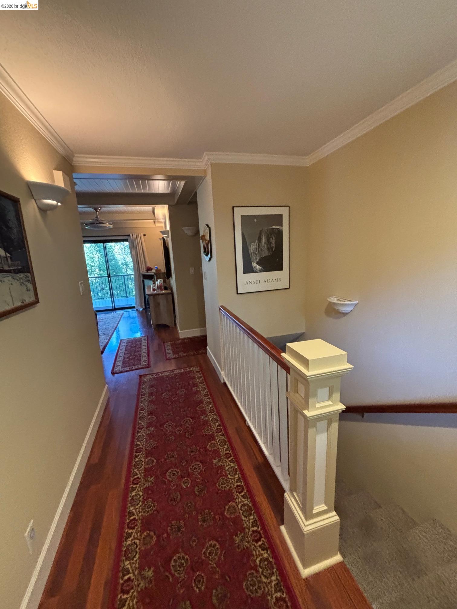 20728 Point View Drive Groveland, CA 95321 - Photo 3 of 45 a hallway with a flower pot and a bookshelf