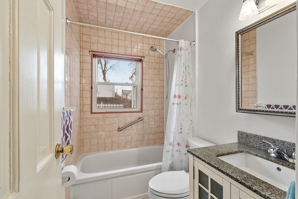 5 Sherman Avenue Haverhill, MA 01832 - Photo 23 of 26 a bathroom with a granite countertop tub sink toilet and mirror