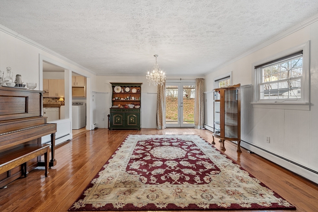 5 Sherman Avenue Haverhill, MA 01832 - Photo 6 of 26 a large bedroom with a bed and wooden floor