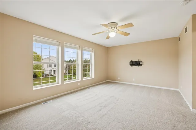 a view of a backyard with a table and chairs